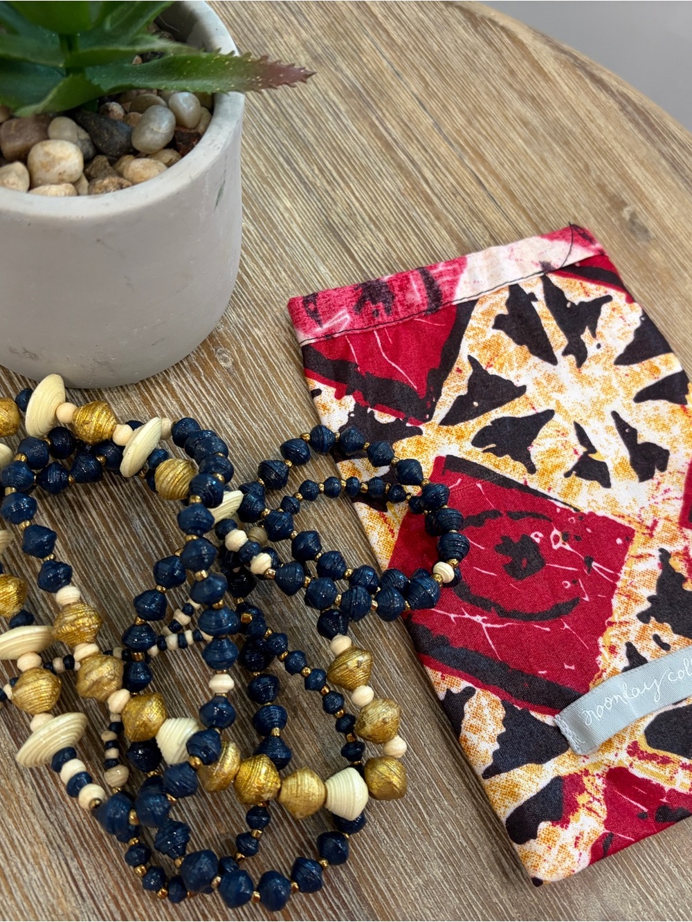 Noonday Collection paper Necklace with Pouch gold navy